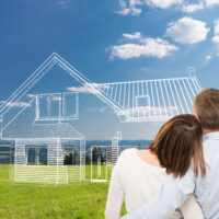 Young couple looking at dream house. Loving young couple looking at dream house.